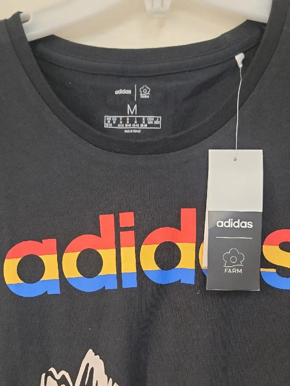 adidas Black Tee with Rainbow Logo and Yellow Butterfly Accents